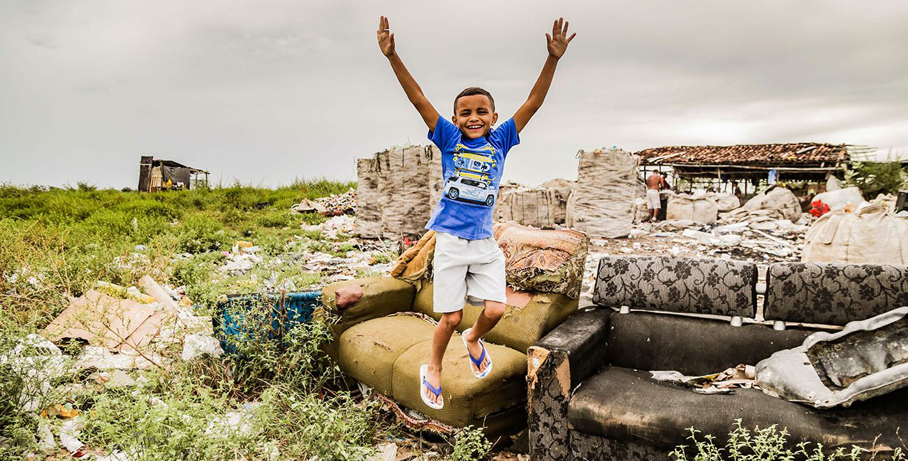 Francisco jumps up on a rubbish dump in Brazil.