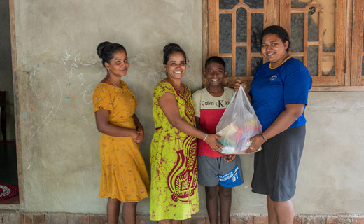 A family receive a food parcel
