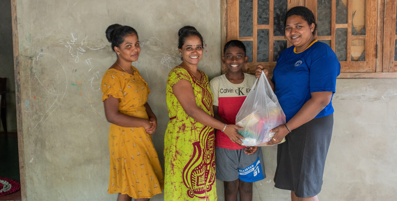 A family receive a food parcel